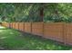 The backyard features a tall wooden fence that provides privacy around the perimeter of the yard at 1309 Hudson Ave # D6, Durham, NC 27705