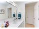 Bright bathroom featuring quartz countertop vanity and a modern faucet, complemented by sleek towel racks at 1309 Hudson Ave # D6, Durham, NC 27705