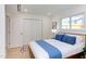 This bedroom features a large window for natural light, a double closet, and hardwood floors at 1309 Hudson Ave # D6, Durham, NC 27705