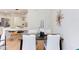 The dining area offers seating for four with modern chairs and view into the kitchen at 1309 Hudson Ave # D6, Durham, NC 27705