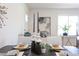 The dining area is bright, offering seating for four with stylish place settings at 1309 Hudson Ave # D6, Durham, NC 27705