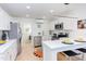 Bright kitchen features stainless steel appliances, stone countertops, and peninsula seating at 1309 Hudson Ave # D6, Durham, NC 27705