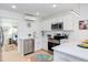 Modern kitchen boasts white cabinetry, stainless appliances, and peninsula seating at 1309 Hudson Ave # D6, Durham, NC 27705