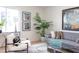 Bright living room with modern decor, featuring a comfortable sofa, stylish chairs, and plenty of natural light at 1309 Hudson Ave # D6, Durham, NC 27705
