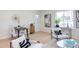 Bright and airy living room with wood floors, stylish decor, and lots of natural light from large window at 1309 Hudson Ave # D6, Durham, NC 27705