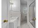 A full bathroom features tiled walls, a shower and bathtub combination, and a vanity with sink at 1402 Tarleton Ave, Burlington, NC 27215