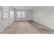 Neutral bedroom featuring carpet flooring, white trim, and a large window at 1402 Tarleton Ave, Burlington, NC 27215