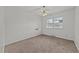 A sunlit bedroom with a ceiling fan and a large window, offering natural light at 1402 Tarleton Ave, Burlington, NC 27215