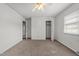 Bedroom with a ceiling fan, closet, and ample natural light from a window at 1402 Tarleton Ave, Burlington, NC 27215