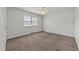 Bedroom with a window and ceiling fan, offering plenty of natural light at 1402 Tarleton Ave, Burlington, NC 27215