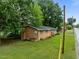 Quaint brick home featuring a classic design and well-maintained landscaping around the property at 1402 Tarleton Ave, Burlington, NC 27215