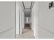 Long hallway featuring carpet flooring, white trim, and multiple doorways at 1402 Tarleton Ave, Burlington, NC 27215