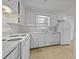 Bright kitchen with classic white cabinets and essential appliances at 1402 Tarleton Ave, Burlington, NC 27215