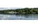 Beautiful lake view reflecting the sky and surrounding trees showing the community area at 1487 Kentucky Ave, Sanford, NC 27332