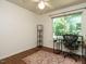 Cozy office with natural light, hardwood floors, ceiling fan, and desk at 1487 Kentucky Ave, Sanford, NC 27332