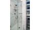 Bathroom features a marble shower with glass door, shelving and spa shower head at 1487 Kentucky Ave, Sanford, NC 27332