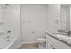 This bathroom features granite countertops, white cabinetry, and a tub/shower combo at 150 Ivy Bank Dr, Angier, NC 27501