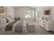 Comfortable bedroom with carpet flooring and a bright window at 150 Ivy Bank Dr, Angier, NC 27501