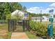 Community dog park featuring a waste station and adjacent homes at 150 Ivy Bank Dr, Angier, NC 27501