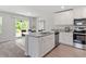 Modern kitchen with stainless steel appliances, granite countertops, and a bright dining area nearby at 150 Ivy Bank Dr, Angier, NC 27501
