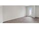 Open living space with wood-look floors and backyard access at 150 Rusling Leaf Dr, Fuquay Varina, NC 27526