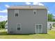 Back exterior view of a two story home with a large yard at 154 Taverners Ln, Angier, NC 27501