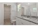 Stylish bathroom features granite countertops, a walk-in closet, and a glass-enclosed shower for a luxurious experience at 154 Taverners Ln, Angier, NC 27501
