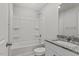 Bright bathroom featuring a shower-tub combo and granite vanity top at 154 Taverners Ln, Angier, NC 27501