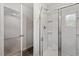 Modern bathroom showcases a glass-enclosed shower and access to a walk-in closet for added convenience and luxury at 154 Taverners Ln, Angier, NC 27501
