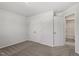Bedroom featuring neutral carpet, neutral walls and a closet with double doors at 154 Taverners Ln, Angier, NC 27501
