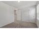 Bright and airy bedroom with neutral carpet and multiple doors, offering versatile living and relaxation options at 154 Taverners Ln, Angier, NC 27501