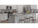 Modern kitchen featuring granite countertops and a large island with seating at 154 Taverners Ln, Angier, NC 27501