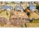 Backyard aerial view of a lovely home with a large grassy area perfect for outdoor activities at 1624 Struble Cir, Willow Springs, NC 27592