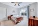 Bedroom with carpet, a window, and a ceiling fan at 1624 Struble Cir, Willow Springs, NC 27592