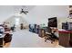 Large bonus room with multiple desks and televisions, perfect for entertainment and hobbies at 1624 Struble Cir, Willow Springs, NC 27592