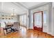 Elegant dining room with hardwood floors, neutral decor, and abundant natural light at 1624 Struble Cir, Willow Springs, NC 27592