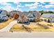 Single Gathering home featuring mature trees in a large yard, with a driveway and partial brick facade at 1624 Struble Cir, Willow Springs, NC 27592