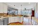 The kitchen features stainless steel appliances and spacious granite countertops at 1624 Struble Cir, Willow Springs, NC 27592