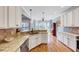 Bright kitchen featuring stainless appliances, ample granite countertops, and stylish cabinetry at 1624 Struble Cir, Willow Springs, NC 27592