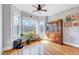 Bright sunroom space with hardwood floors and ample natural light at 1624 Struble Cir, Willow Springs, NC 27592