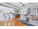 Open-concept layout with a view into living room, kitchen, and foyer with wood floors at 1624 Struble Cir, Willow Springs, NC 27592