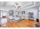 Spacious living room with hardwood floors, tray ceiling, and comfortable seating at 1624 Struble Cir, Willow Springs, NC 27592