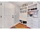 Well-organized mudroom with built-in storage, including shelves, drawers, and hooks at 1624 Struble Cir, Willow Springs, NC 27592