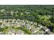 Picturesque aerial view of neighborhood near a tranquil lake, lush trees, and well-manicured lawns at 2120 Rainy Lake St, Wake Forest, NC 27587