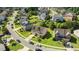 Aerial view of a neighborhood featuring well-maintained lawns, mature trees, and quiet streets at 2120 Rainy Lake St, Wake Forest, NC 27587