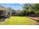 Spacious backyard featuring a lush lawn, privacy fence, and a relaxing hammock area at 2120 Rainy Lake St, Wake Forest, NC 27587
