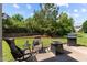 Backyard patio with comfortable seating, grill, and landscaped garden at 2120 Rainy Lake St, Wake Forest, NC 27587