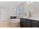Spacious bathroom offers a soaking tub, dual vanities, and plenty of natural light at 2120 Rainy Lake St, Wake Forest, NC 27587