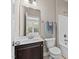 Bathroom with vanity, toilet, mirror, and shower/tub combo with tile surround at 2120 Rainy Lake St, Wake Forest, NC 27587