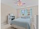 Bedroom with a ceiling fan, dresser, and natural light from the two windows at 2120 Rainy Lake St, Wake Forest, NC 27587